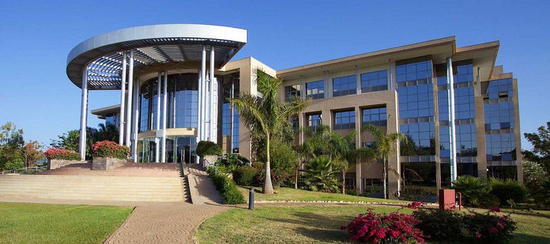 African university council members in a governance meeting at a Kenyan institution
